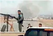  ?? AFP/HO/ANHA ?? An image grab taken from a video on Monday shows the scene of a suicide car bomb attack on a military convoy on a road in Syria’s Hasakeh province.—