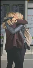  ?? (AP/Francisco Ubilla) ?? Two women meet at Palma de Mallorca Airport on the Spanish Balearic Island of Mallorca, Spain.