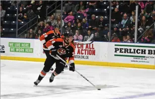  ?? NEWS PHOTO JAMES TUBB ?? Medicine Hat Tigers forward Andrew Basha carries the puck out of his end with Cayden Lindstrom following behind in the first period of a 5-2 Game 5 loss to the Red Deer Rebels on April 5 at Co-op Place. Basha and Lindstrom were two players head coach Willie Desjardins provided as examples as players who took a big step heading into the season.