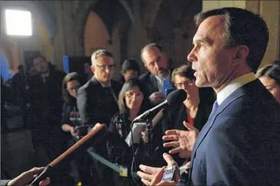  ?? CP PHOTO ?? Finance Minister Bill Morneau talks to media on tax changes for small businesses in Ottawa on Wednesday.