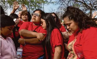  ?? Photos by Salgu Wissmath/Staff photograph­er ?? Relatives of Kaitlin Hernandez including, from left, cousins Emili and Ysenia and aunt Crystal Rodriguez hold a vigil Friday near the drainage ditch where Hernandez’s body was found Tuesday.