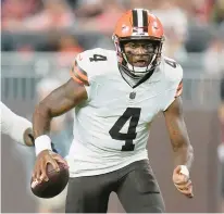  ?? SUE OGROCKI/AP ?? Browns quarterbac­k Deshaun Watson runs against the Commanders during the first half of a preseason game Friday in Cleveland.