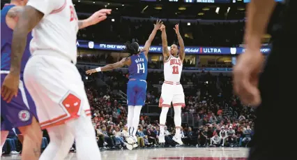  ?? CHRIS SWEDA/CHICAGO TRIBUNE ?? DeMar DeRozan shoots over Clippers guard Terance Mann (14) during a game on March 14.