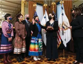  ?? ASSOCIATED PRESS/ALEX BRANDON ?? Vice President Kamala Harris (right) swears in Interior Secretary Deb Haaland (third from right) with daughter Somah Haaland (second from right) on March 18, 2021.