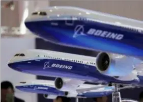  ?? KIN CHEUNG — THE ASSOCIATED PRESS FILE ?? Models of a Boeing passenger airliner are displayed during the 12th China Internatio­nal Aviation and Aerospace Exhibition, also known as Airshow China 2018, in Zhuhai city, south China’s Guangdong province. Boeing Co. canceled a conference call that it scheduled for Tuesday with airlines to discuss issues swirling around its newest plane, which has come under close scrutiny after a deadly crash in Indonesia.