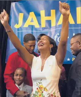  ?? PATRICK RAYCRAFT | PRAYCRAFT@COURANT.COM ?? SURROUNDED BY FAMILY and friends on election night, Jahana Hayes, Democratic congressio­nal candidate for Connecticu­t's 5th District, declares victory in Waterbury on Tuesday.