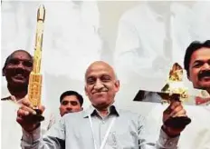  ?? PTI ?? Isro Chairman A.S. Kiran Kumar with his team during a press conference after the sucesseful launch of SCATSAT-1 and seven other satellites in Sriharikot­a yesterday.