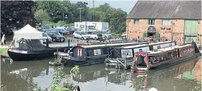  ?? ?? Decorated boats outside a salt warehouse, built in 1777 and now home to Shardlow Heritage Centre.