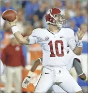  ?? Lexington Herald/TNS - Mark Cornelison ?? Former Alabama star AJ McCarron, the last quarterbac­k to lead his team to consecutiv­e national championsh­ips, said he is rooting for Georgia’s Stetson Bennett to join the club.