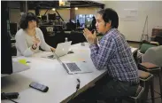  ??  ?? Pinterest’s Discovery Team engineers Stephanie deWet and Wangfan Fu talk things over.