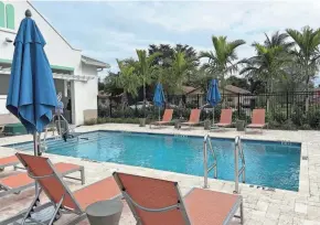  ?? JASMINE FERNÁNDEZ/PALM BEACH POST ?? Among some of the Island Cove amenities are an outdoor courtyard, community clubhouse, pool, gym, a children’s playground and a basketball court.