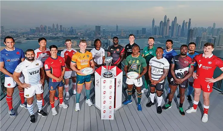  ?? Photo: 30, 2022. World Rugby ?? Fiji Airways Fijians men’s sevens captain Waisea Nacuqu (front, fifth from left) and All Blacks sevens captain Sam Dickson (back, sixth from left) during the photo shoot in Dubai on November
