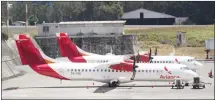  ??  ?? In this file photo, aircraft from the Avianca airline sit parked at La Aurora
airport in Guatemala City.