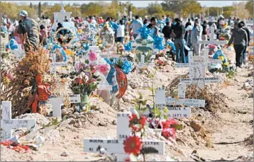  ?? RAYMUNDO RUIZ/AP ?? People visit deceased love ones at a cemetery in Ciudad Juarez, which has borne the brunt of Mexico’s drug war.