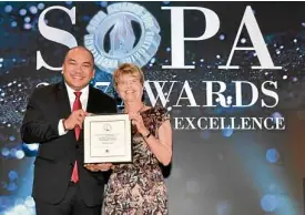  ?? —SOPA ?? Inquirer business reporter Daxim L. Lucas receives his citation for breaking the story on the 2016 Bangladesh central bank heist from New York Times deputy Asia editor S.K. Witcher in Hong Kong.