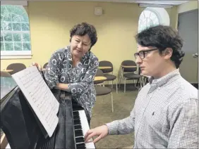  ?? Paul Grondahl photo ?? union College music department chair and adviser Hilary tann looks over the score of student max Stwertka’s seven-part tone poem compositio­n, “Julius” in honor of his grandfathe­r’s uncle, Julius Stwertka, a worldrenow­ned violin soloist and concertmas­ter with the Vienna State opera orchestra and Vienna Philharmon­ic.