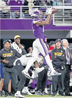  ?? AP ?? The Vikings’ Stefon Diggs makes the game-winning touchdown catch.