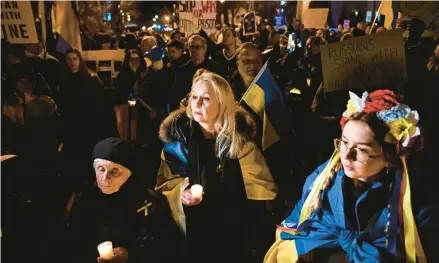  ?? KENNY HOLSTON/THE NEW YORK TIMES ?? A candleligh­t vigil against Russia’s war in Ukraine is held outside the Russian Embassy on Feb. 24 in Washington.