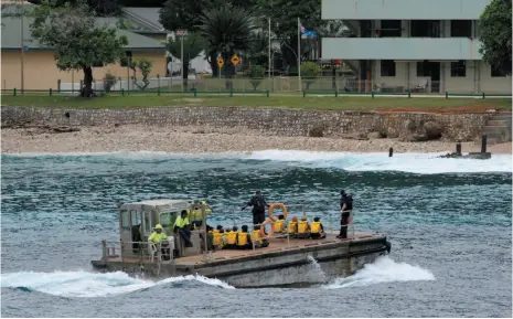  ?? AP FILE PHOTO ?? A group of Vietnamese asylum seekers are taken by barge to a jetty on Australia’s Christmas Island on April 14, 2013.