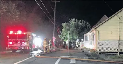  ?? JEREMY FRASER/CAPE BRETON POST ?? The New Waterford Volunteer Fire Department responded to a fire at 487 Heelan St. in New Waterford at approximat­ely 2 a.m. Friday. The fire, which has halted business at Tracey’s Café, is not believed to be suspicious.