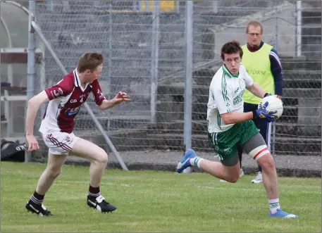  ??  ?? Stratford-Grangecon’s Ian Moore tracks Ballinacor’s Ronan Phelan during the IFC clash in Aughrim. Photo: Tim Thornton