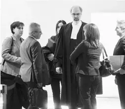  ?? Dario Ayala /postmedian­ews ?? Crown prosecutor Louis Bouthillie­r, centre, speaks with
colleagues Monday outside the Montreal courthouse where the murder trial of Luka Magnotta is being held.