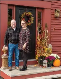  ??  ?? Joe and Julie decorate their front porch with a bountiful fall display that welcomes friends and family.