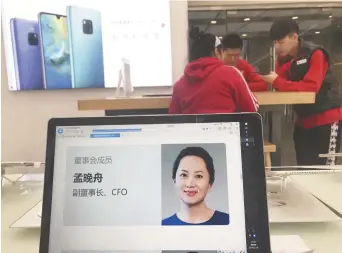  ?? – Associated Press: Ng Han Guan ?? Le profil de Meng Wanzhou est affiché sur un écran dans une boutique de Huawei à Pékin, jeudi.