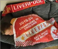  ??  ?? It’s hard work being Champions, Ryan O’Sullivan from Mallow was in dreamland following Liverpool’s title triumph.