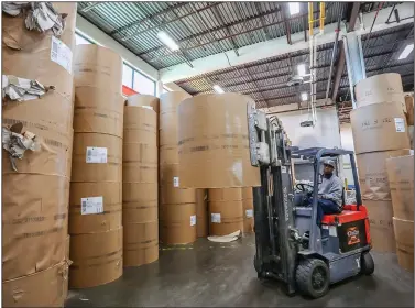  ?? Arkansas Democrat-Gazette/JOHN SYKES JR. ?? A forklift operator moves a roll of newsprint Thursday at the Arkansas Democrat-Gazette printing plant in Little Rock. The U.S. Commerce Department has levied tariffs of up to 30 percent on newsprint manufactur­ed in Canada.