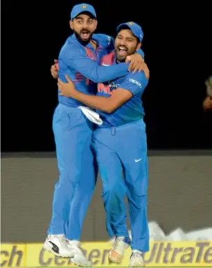  ?? AFP ?? Virat Kohli (left) led India is expected to give tough time to hosts South Africa and Rohit Sharma (right) reckons it would be different kind of challenge against the Proteas. —