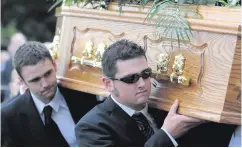  ??  ?? William and Michael carry their father’s coffin at his funeral; a family picture of Michael and brothers Daniel and William with their dad (right), and (inset) a family photo of Robert and wife Louise