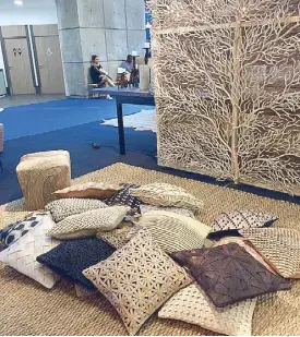  ??  ?? Tree of Life wall panel and cushions in natural fibers by Tadeco Home.