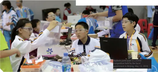  ??  ?? Students participat­e in a STEM competitio­n held by the local government in Beijing, May 13, 2018