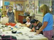  ?? SUBMITTED PHOTO ?? Ray Lapinski, left, assisting a class at Clay on Main.