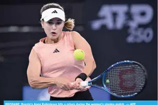  ?? ?? BRISBANE: Russia’s Anna Kalinskaya hits a return during the women’s singles match. — AFP