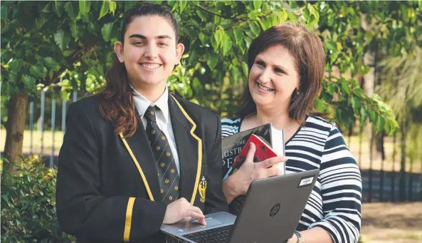  ??  ?? SUPPORT: Katarina Kanellos gets some study help from her mum Sandra. Picture: ROGER WYMAN