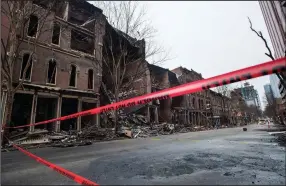  ?? (AP/The Tennessean/Andrew Nelles) ?? Buildings damaged in the Christmas Day explosion are taped off Thursday in downtown Nashville, Tenn. Officials are continuing to assess the damage.