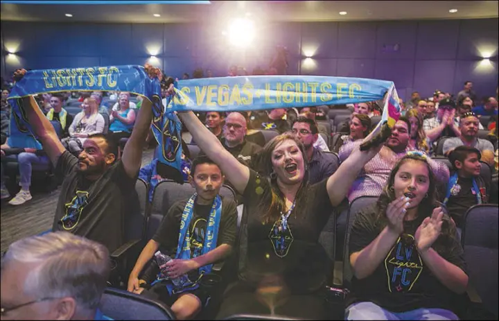  ??  ?? Fans cheer during the Las Vegas Lights FC Zappos-sponsored jersey unveiling Wednesday at the Zappos Theater.