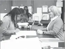  ?? Brodie Johnson • Times-Herald ?? Candidates for St. Francis County Assessor file their paperwork today with St. Francis County Clerk Brandi McCoy. In the top photo, Alvin Taggart files for the position. Assessor candidate Ginadell Adams is pictured in the bottom photo. The one-week filing period continues until noon Tuesday, March 1.