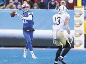  ?? STEVE CONNER/AP ?? BYU quarterbac­k Zach Wilson went a perfect 18-18 in Friday’s 49-18 win over Western Michigan in the Famous Idaho Potato Bowl in Boise, Idaho.
