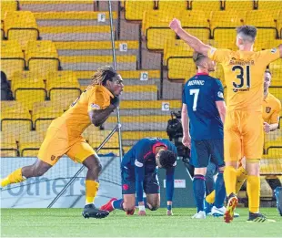  ?? Picture: SNS. ?? Dolly Menga races away after scoring Livingston’s second.