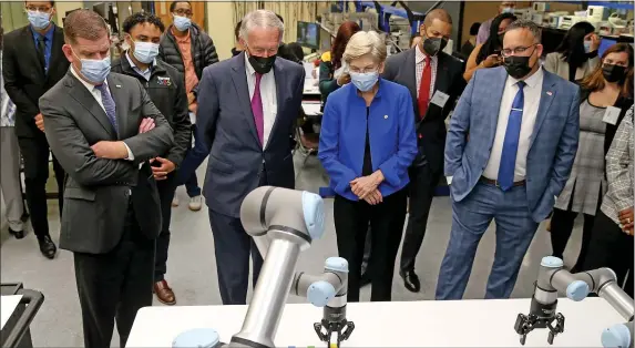  ?? MATT STONE — BOSTON HERALD ?? Employer demands in fields like bio tech and robotics, as seen here by Secretary of Labor Marty Walsh, Senators Ed Markey and Elizabeth Warren and with Secretary of Education Miguel Cardona during a demonstrat­ion at the Benjamin Franklin Cummings Institute of Technology, will drive the needs of the Massachuse­tts economy in coming years.