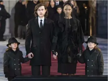  ?? PAUL CHIASSON/THE CANADIAN PRESS VIA THE ASSOCIATED PRESS ?? Céline Dion leaves the church with her children, René-Charles, second from left, and twins Eddy and Nelson.