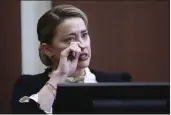  ?? JIM LO SCALZO — POOL PHOTO ?? Actor Amber Heard testifies in the courtroom at the Fairfax County Circuit Court in Fairfax, Va., on Thursday.