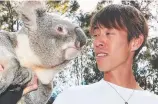  ??  ?? Women’s marathon winner Abebech Bekele meets a kangaroo while men’s champion Takuya Noguchi stares down Tyson the koala.