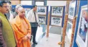  ?? HT PHOTO ?? UP CM Yogi Adityanath and Maharashtr­a CM Devendra Fadnavis (extreme right) at a photo exhibition on the life of Lokmanya Bal Gangadhar Tilak in Lucknow on Saturday.