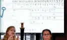  ?? Verhaegen/AFP/Getty Images ?? Cécile Pierrot (L) and senior lecturer in modern history Camille Desenclos (R) explain the decoding process of an encrypted letter from Charles V. Photograph: JeanChrist­ophe