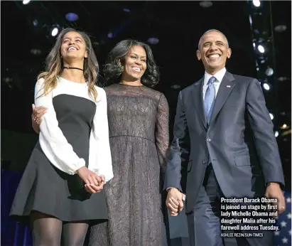  ?? ASHLEE REZIN/ SUN- TIMES ?? President Barack Obama is joined on stage by first lady Michelle Obama and daughter Malia after his farewell address Tuesday.