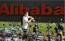  ?? AP FILE ?? As China’s ruling party aims to lead economic developmen­t, internet giants like Alibaba try to keep in line by backing what the government wants, things like robotics, chips and hardware.